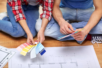 Wall Mural - close up of couple with blueprint and samples