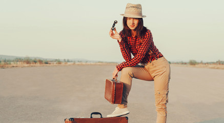 Sticker - Traveler girl with binoculars and suitcase