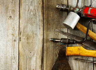 Various tools on a wooden background.