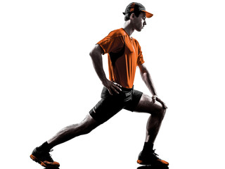Wall Mural - man runner jogger stretching warming up silhouette