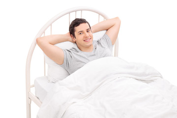 Sticker - Relaxed young man lying in a comfortable bed