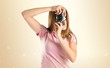 © luismolinero - Girl photographing over white background