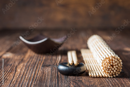 Fotografie, Obraz mat for sushi and chopsticks on dark wooden background.
