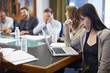 © Westend61 - Businesswoman using laptop in boardroom