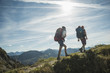 © Westend61 - Austria, Tyrol, Tannheimer Tal, young couple hiking on mountain trail