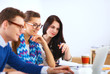 © lenets_tan - Young business people working at office on new project
