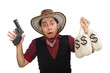 Young cowboy with gun and money bags isolated on white