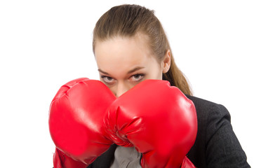 Businesswoman with boxing gloves isolated on white