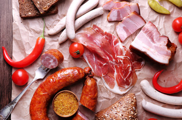 Canvas Print - Assortment of deli meats on parchment, closeup