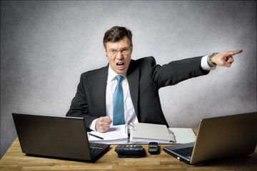 Angry business man in office