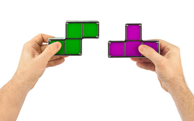 Wall Mural - Hands with tetris toy blocks