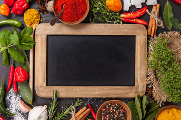 Wall Mural - Various spices on stone with blackboard
