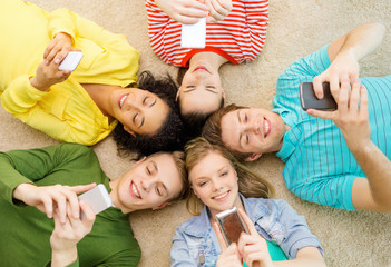 Sticker - group of smiling people lying down on floor