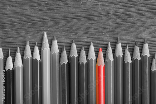 Naklejka dekoracyjna Red pencil among black and white