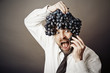 Man with grape on his head