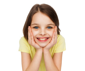 Wall Mural - smiling little girl over white background