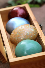 Wall Mural - Spring celebrate, Colorful easter eggs in wooden box(shallow dof