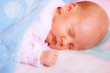 © Voyagerix - Little newborn baby girl 24 days sleeps