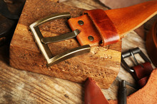 Craft Tools With Leather Belt On Table Close Up