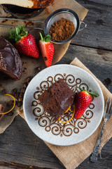 Wall Mural - overhead view on chocolate torte cake served on plate