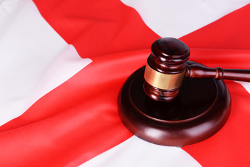 Wooden gavel on England flag background