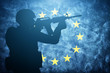 © Photocreo Bednarek - Soldier on grunge European Union flag. Army, military of Europe