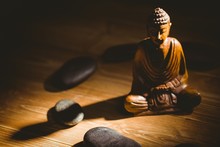 Wooden Buddha Statue On Table