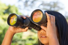 Cute Little Girl Looking Through Binoculars