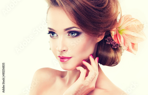 Poster Spring freshness. Girl with delicate pastel flowers in hair