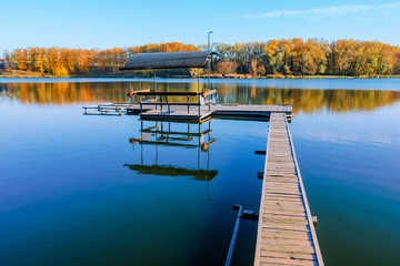  fishing dock  in a lake at  sunset