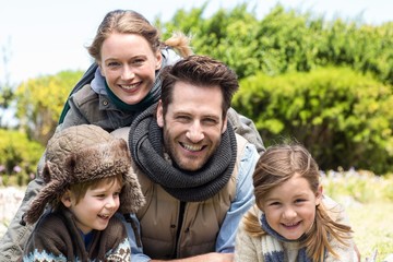 Wall Mural - Happy family smiling at camera