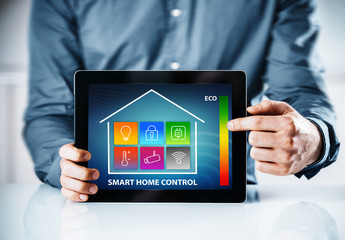 Man pointing to an interface for a smart house