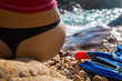 © lesnoj - Sexy girl in sportswear and tanga string sitting on the cliff of
