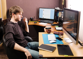 Freelance developer and designer working at home, man using desk