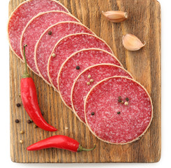 Wall Mural - Slices of salami with chili pepper and spices