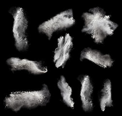 Abstract design of white powder cloud against black