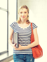 Wall Mural - happy and smiling teenage girl with laptop