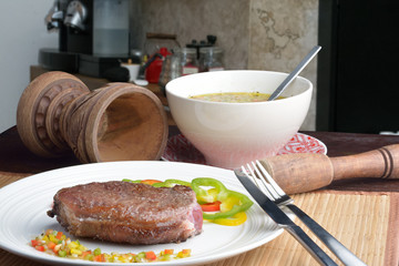 Wall Mural - .steak with vinaigrette: sweet pepper, onion and tomato