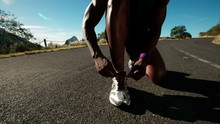 African American Runner Tying His Shoelaces