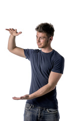 Wall Mural - Young man holding empty vertical space between hands