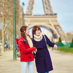 Two young girls in Paris near the Eiffel tower