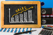 © cacaroot - sales graph hand drawing on blackboard