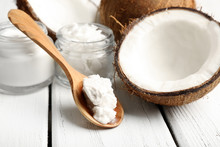 Coconut With Jars Of Coconut Oil And Cosmetic Cream