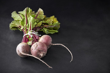 Fresh beetroot bunch on blackboard