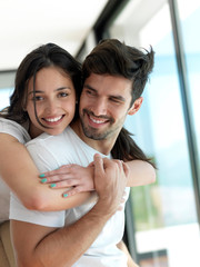 Wall Mural - relaxed young couple at home