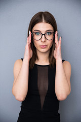 Wall Mural - Beautiful woman in glasses looking at the camera