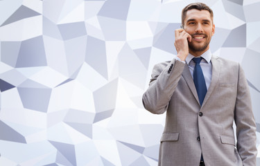 Sticker - smiling businessman with smartphone outdoors