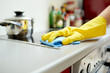 © Syda Productions - close up of woman cleaning cooker at home kitchen