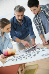 Canvas Print - Students with trainer working on architecture project