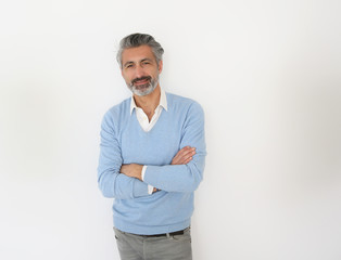 Canvas Print - Handsome mature man standing on white background